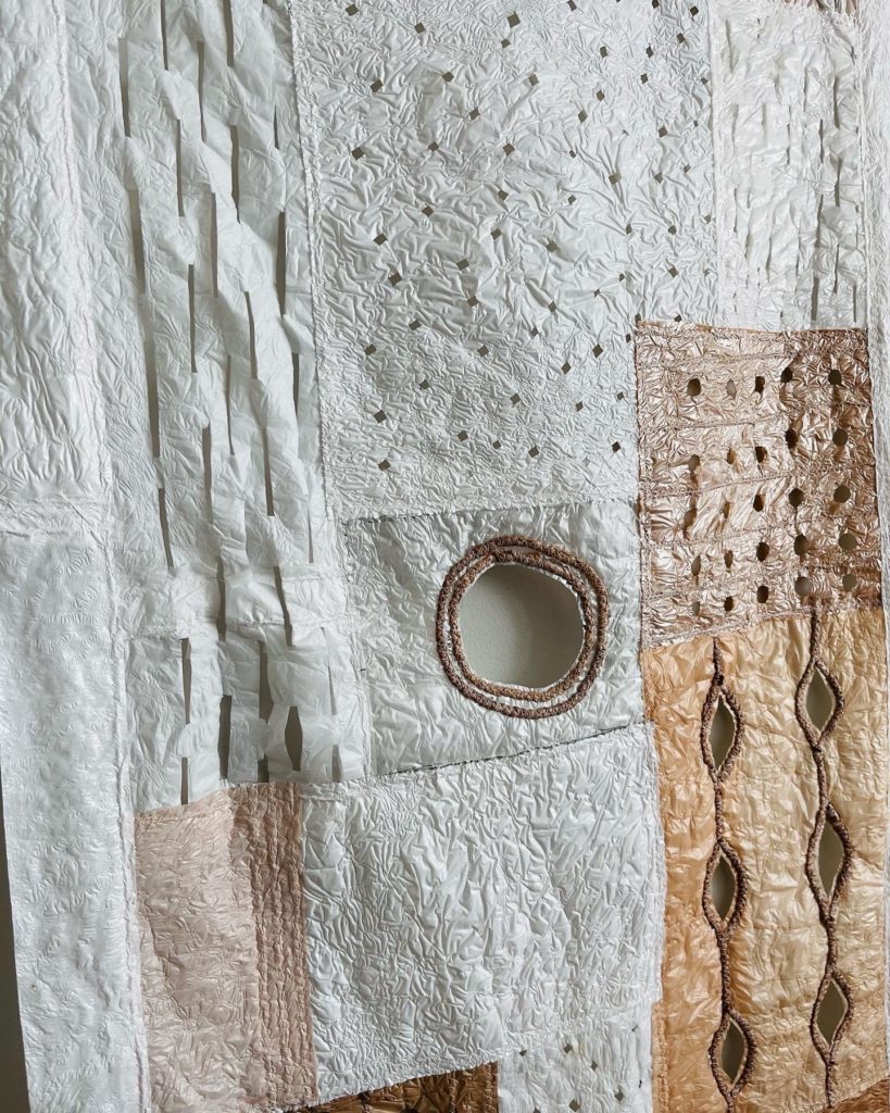 a close up of a white quilt