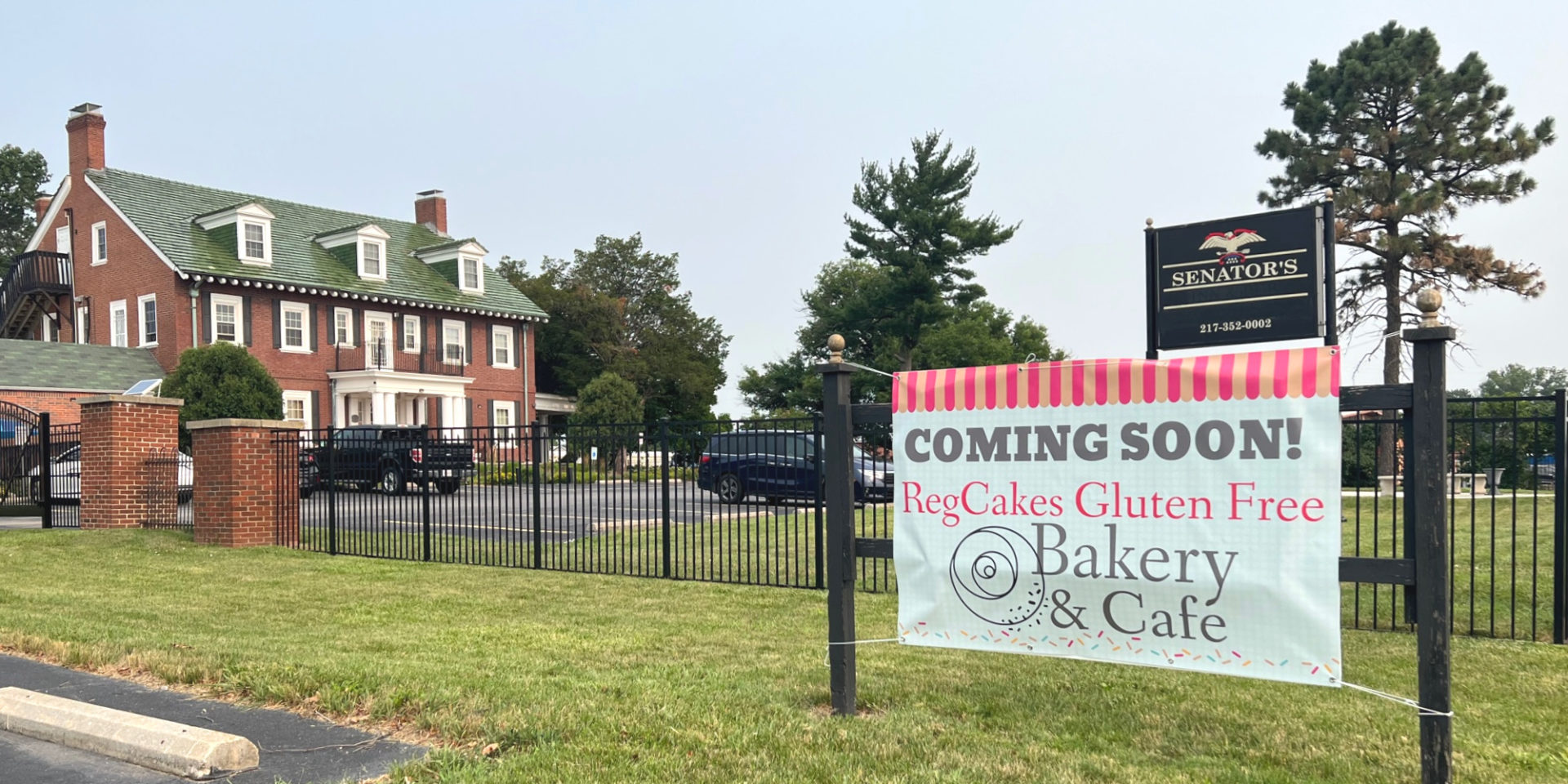 RegCakes Bakery has a banner outside of Senator's Inn announcing "Coming soon" in Savoy, Illinois. Photo by Alyssa Buckley