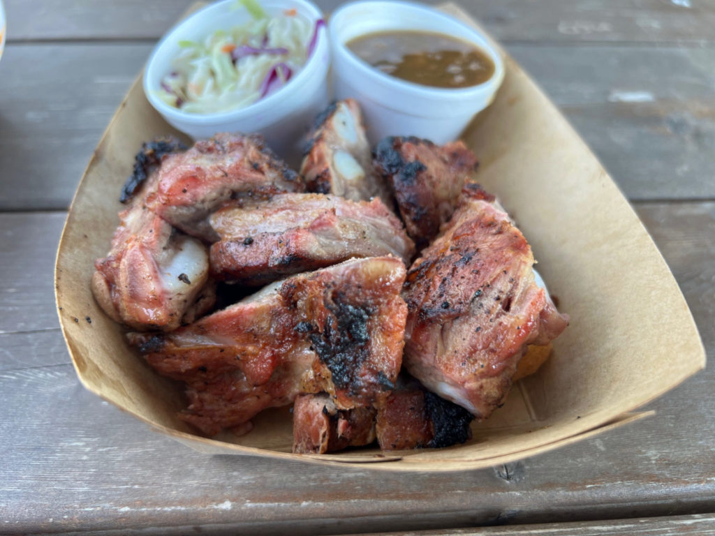 The rib tips from Mama Duke's Food truck are in a brown paper basket, unsauced with a great looking char. Photo by Alyssa Buckley.