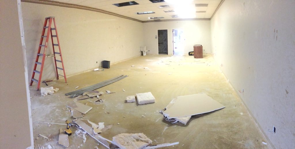 A white room with four walls and work zone in disarray. Photo courtesy of Caribbean Grill.