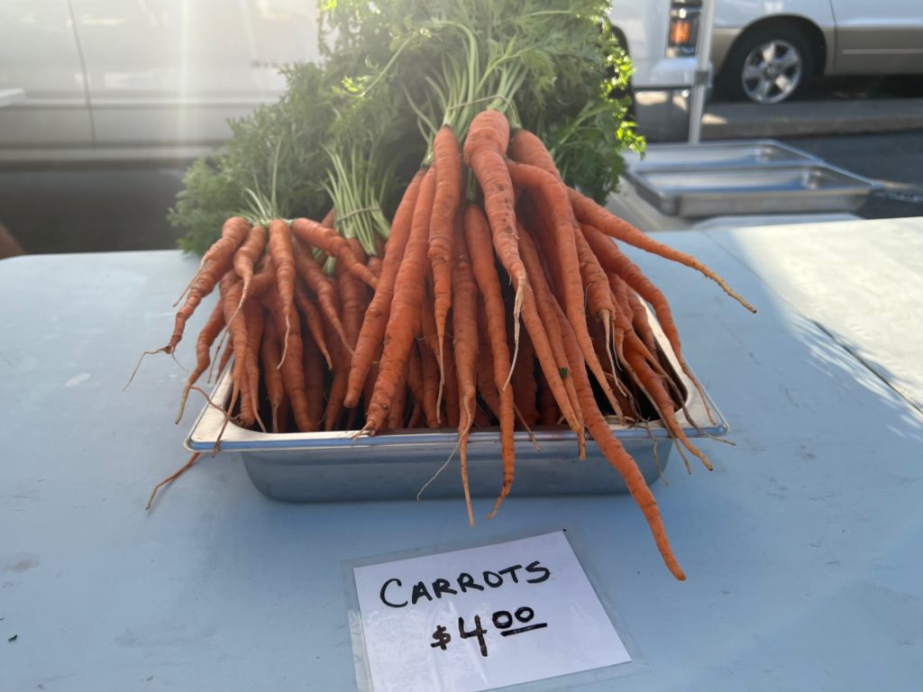 Carrots for sale at the farmers' market. Photo by Alyssa Buckley.