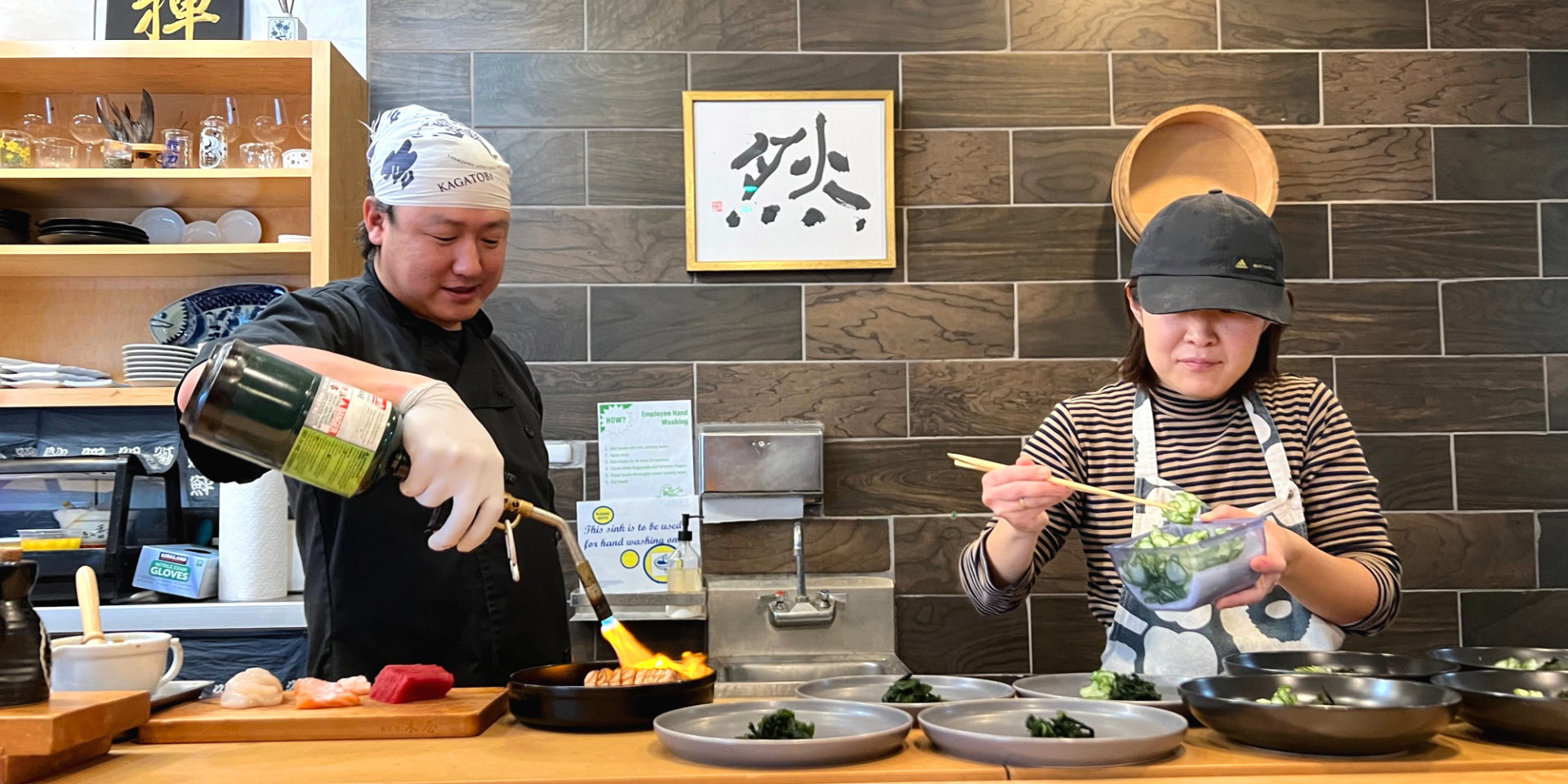 At ISHI and Kaori's Oven, Chef Ken Ishibashi and Kaori Ishibashi prepare omakase inside their Champaign restaurant. Photo by Alyssa Buckley.