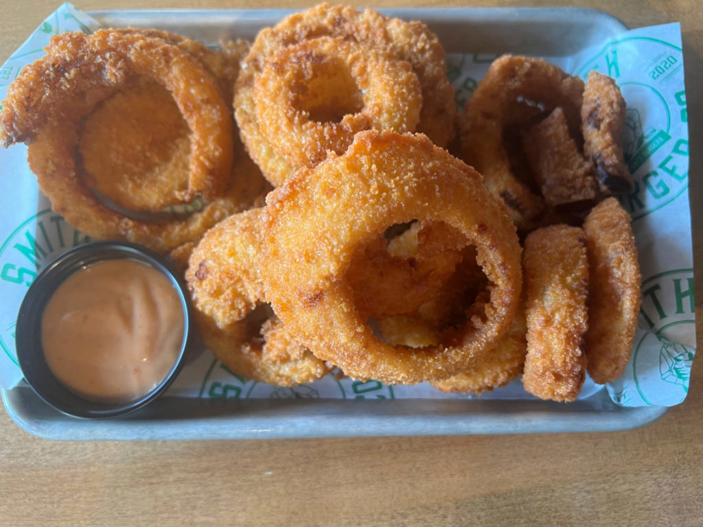 An order of onion rings by Smith Burger Co for dine in. Photo by Alyssa Buckley.
