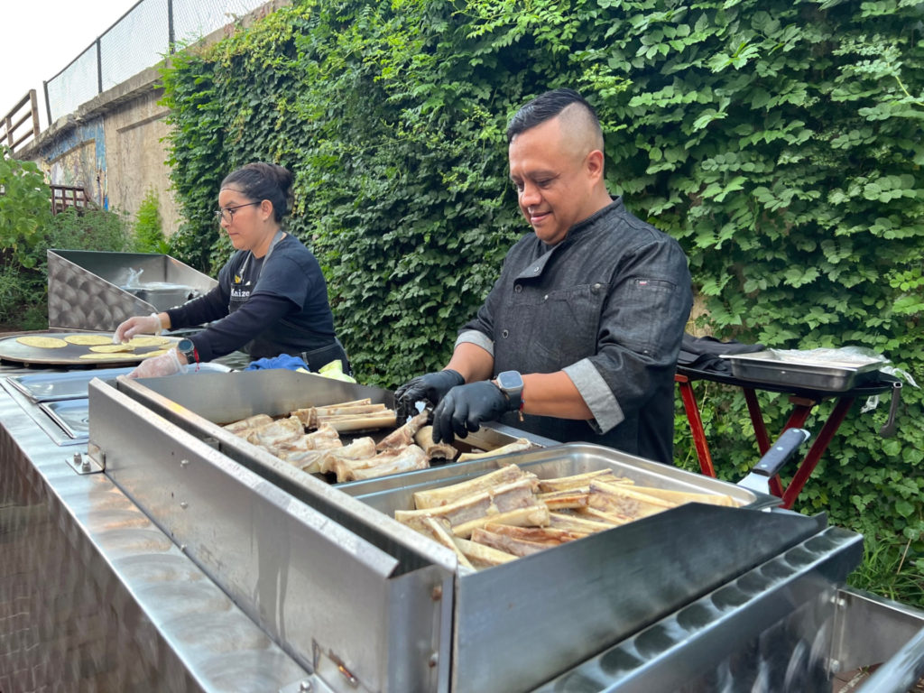 Outside, Maize prepares bone marrow on an outside griddle for the summer tequila tasting dinner. Photo by Alyssa Buckley.