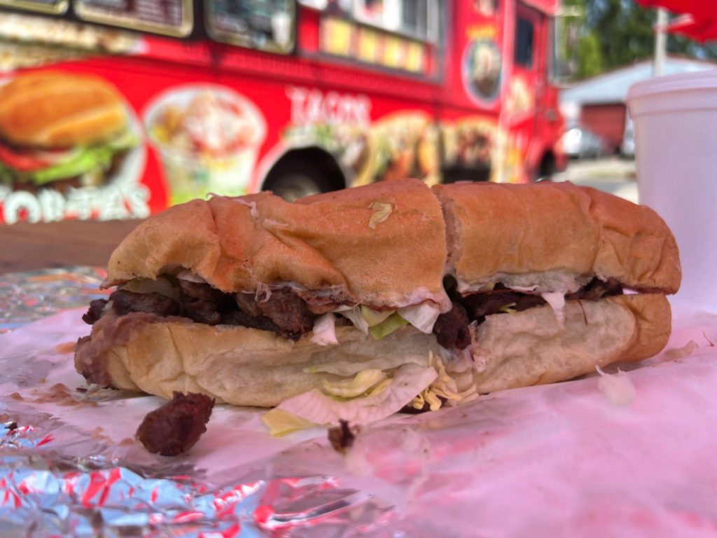 A steak torta sits in front of the Los Paisas food truck on Cunningham Avenue in Urbana. Photo by Alyssa Buckley.