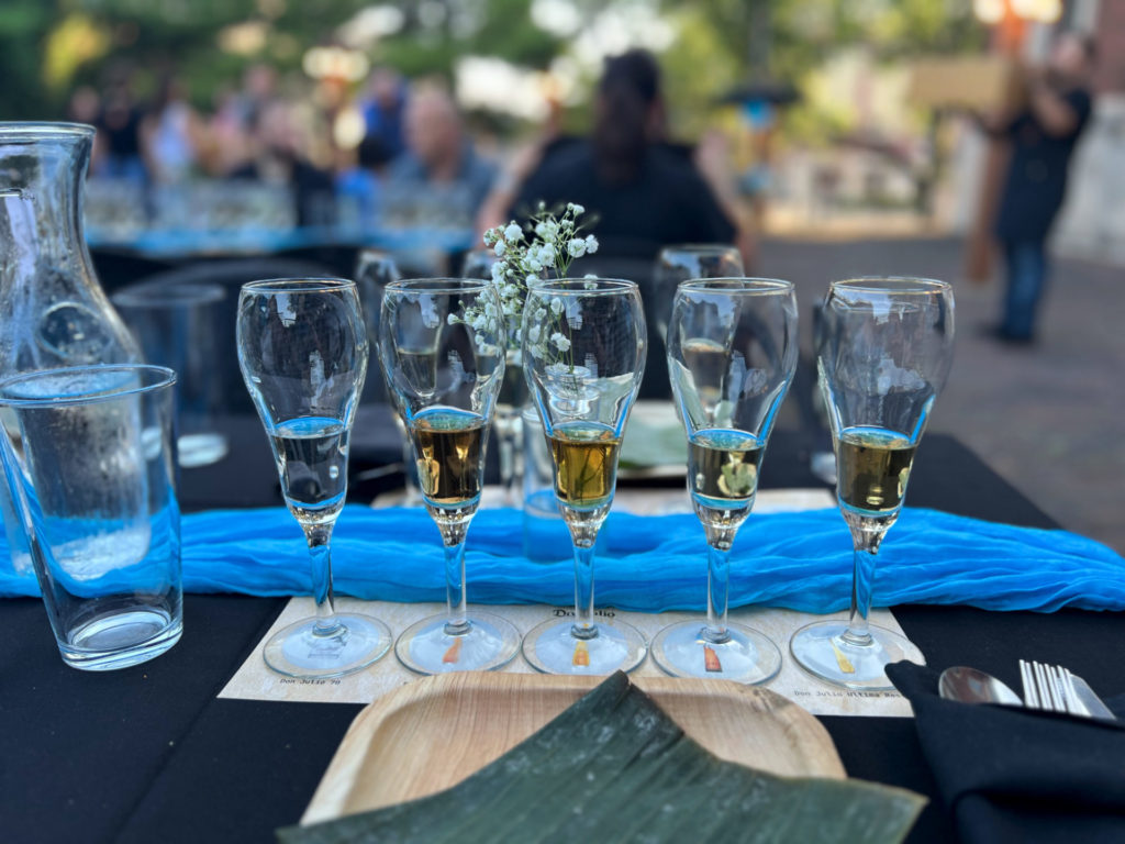 The table setting for the tequila dinner at Maize has five fluted glasses with small pours of Don Julio tequila. Photo by Alyssa Buckley.