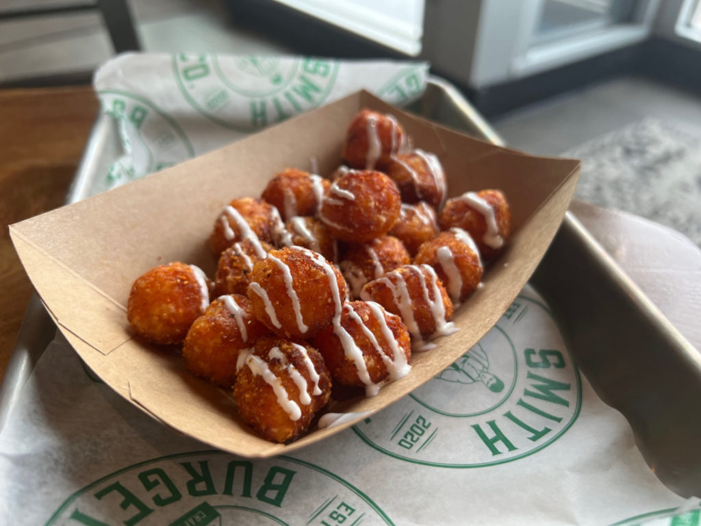 An order of sweet potato tots garnished with a mallow cream. Photo by Alyssa Buckley.