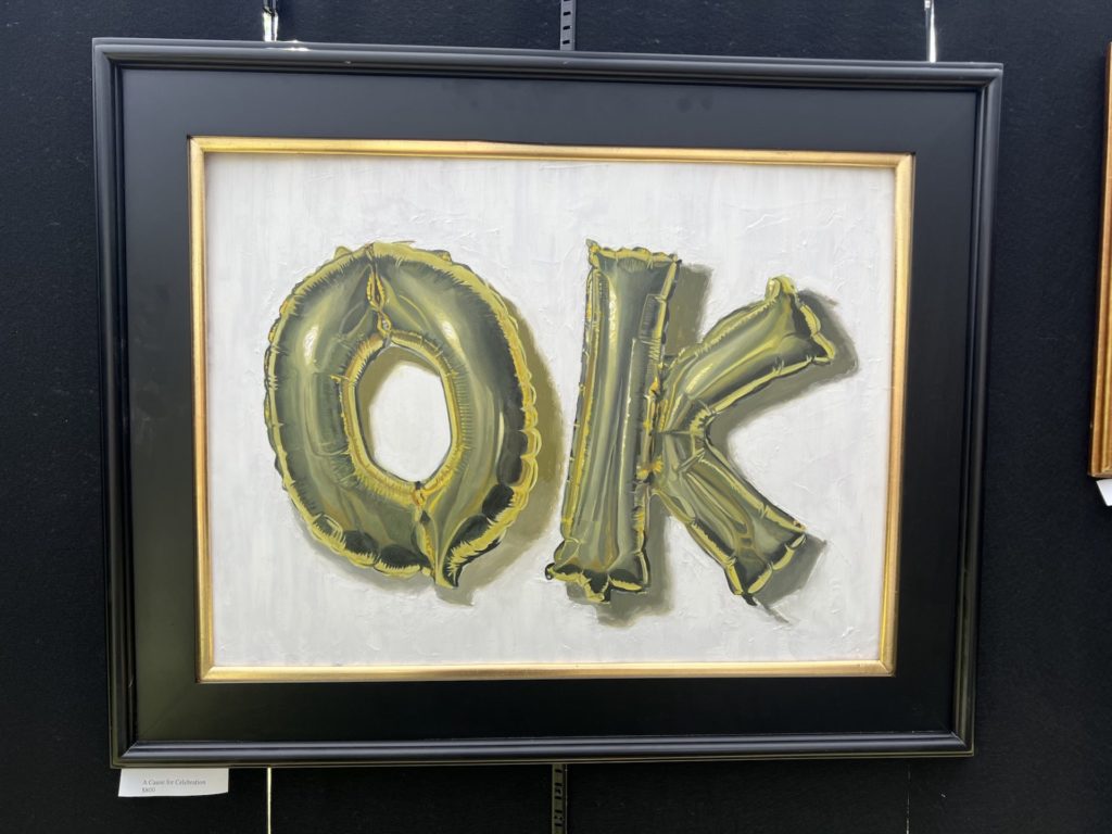 realist painting of letter balloons spelling "OK" in a black frame