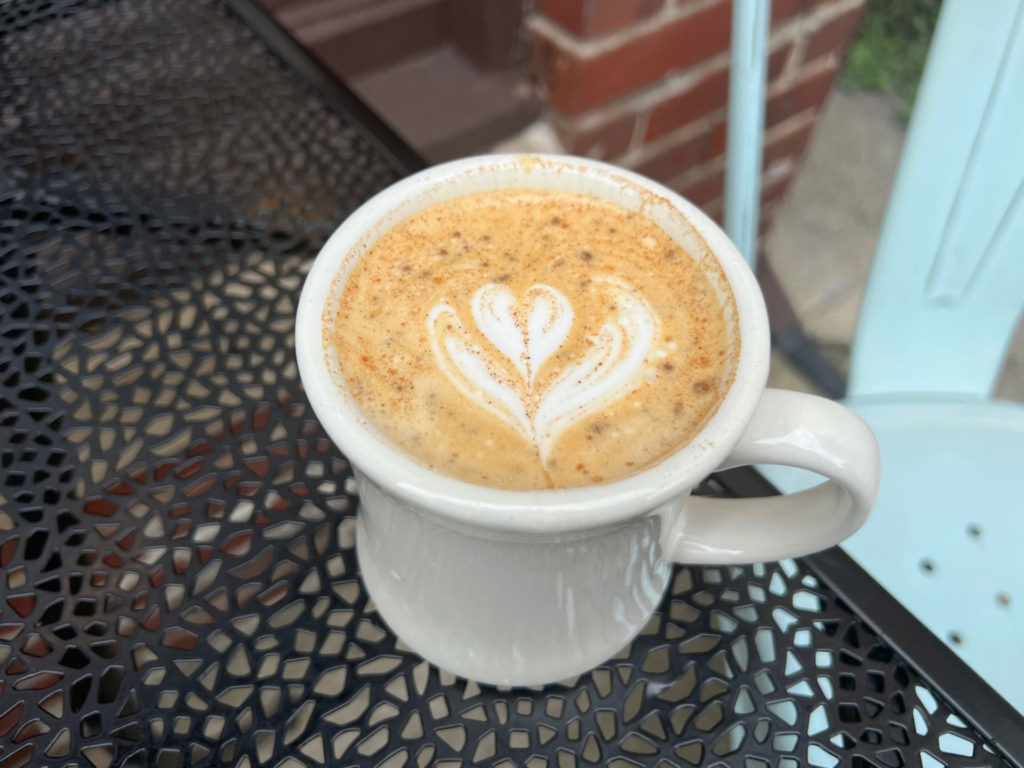 A butter pecan latte at Caffe Paradiso has a little flower with a heart design in the foam.