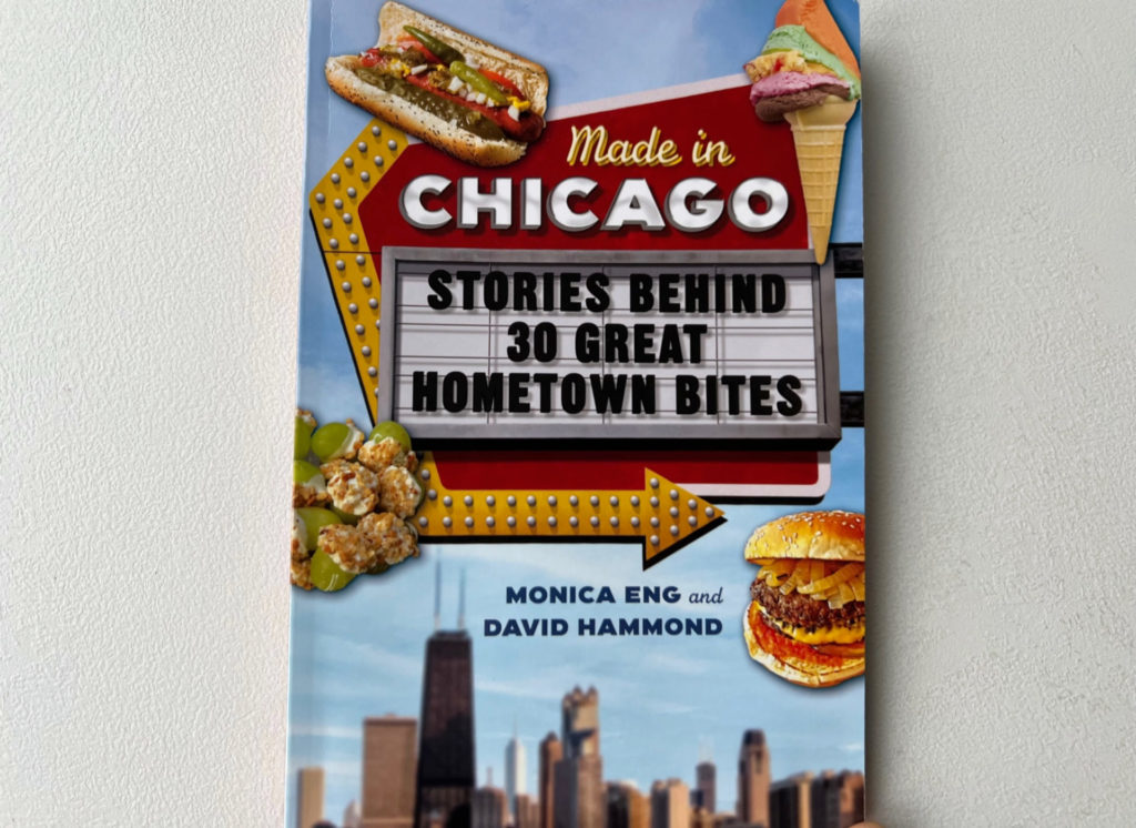 A photo of Made in Chicago: stories behind 30 great hometown bites by Monica Eng and David Hammond on a white table.