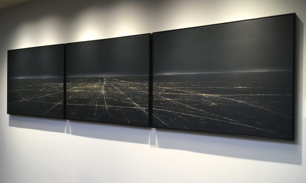 3 horizontal canvases make up a single picture of artwork. Champaign-Urbana at night, with only street lights showing the streets
