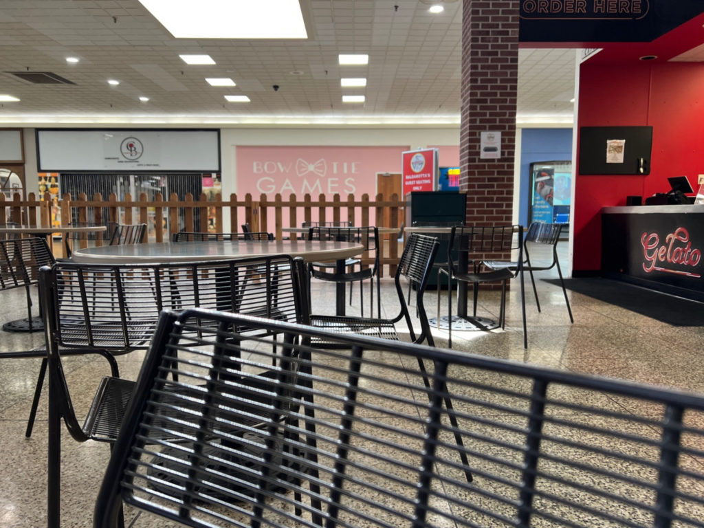 There are metal chairs inside the Baldarotta's dining area inside the Lincoln Square Mall