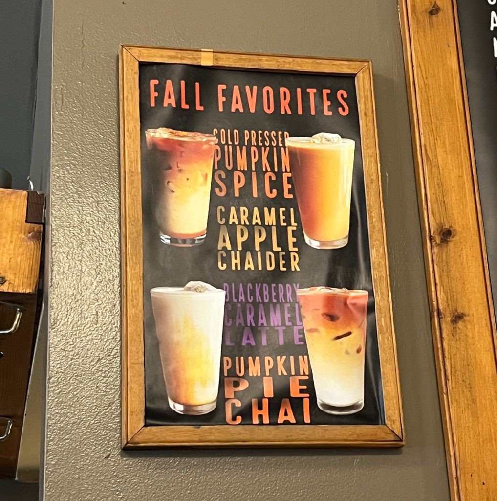 A drink menu title Fall Favorites, featuring photos of four drinks in pint glasses with liquids in shades of white and brown.