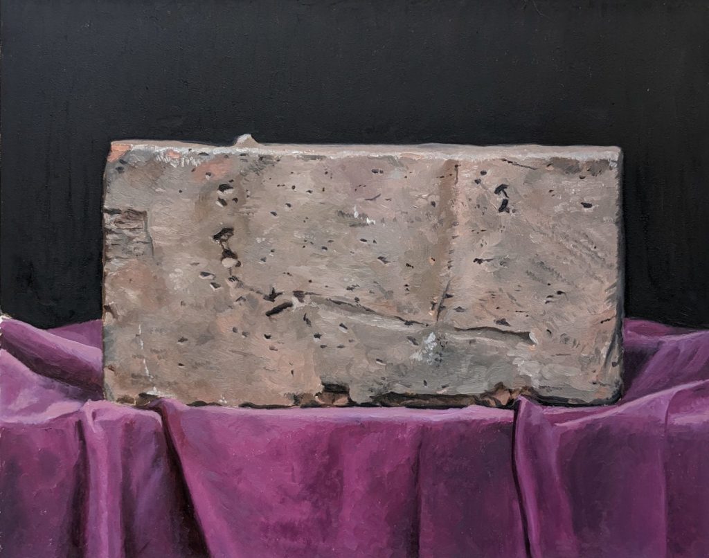 Painting of a concrete brick on a stand covered with purple fabric