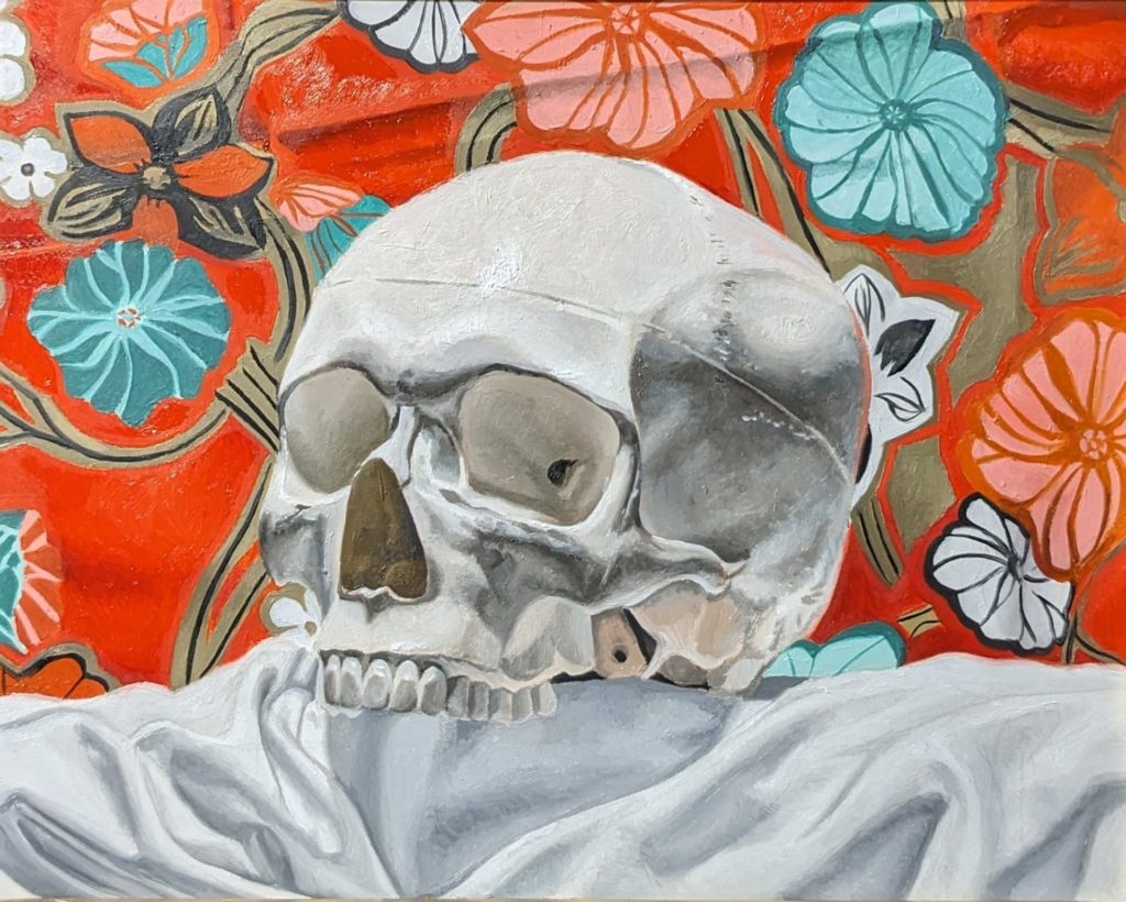 Painting of a skull sitting on white fabric with a bright Hawaiian floral background