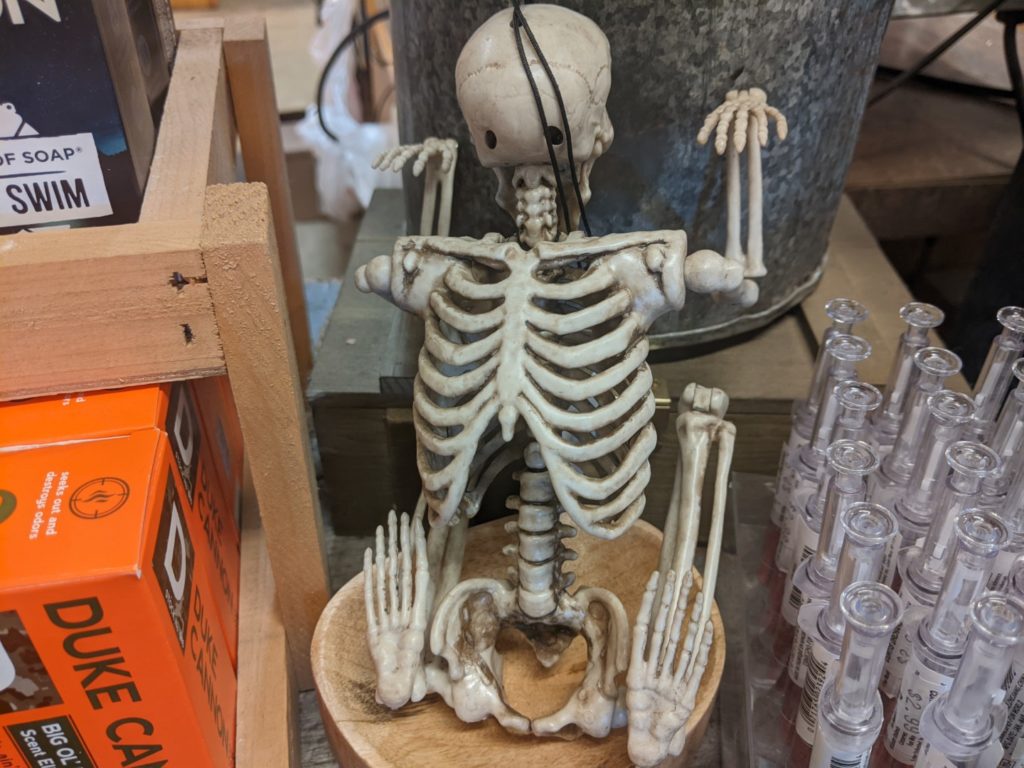 A skeleton in a backwards crouched position with the head facing the wrong way