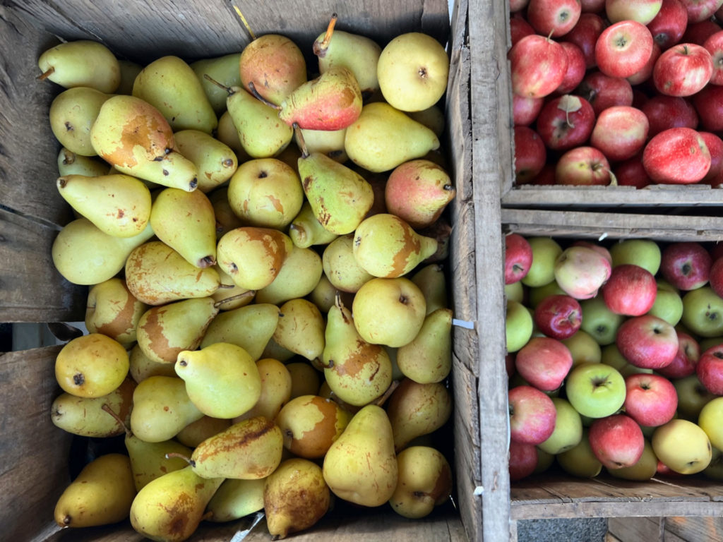 Wooden containers of pears and apples for sale at the C-U farmers' markets