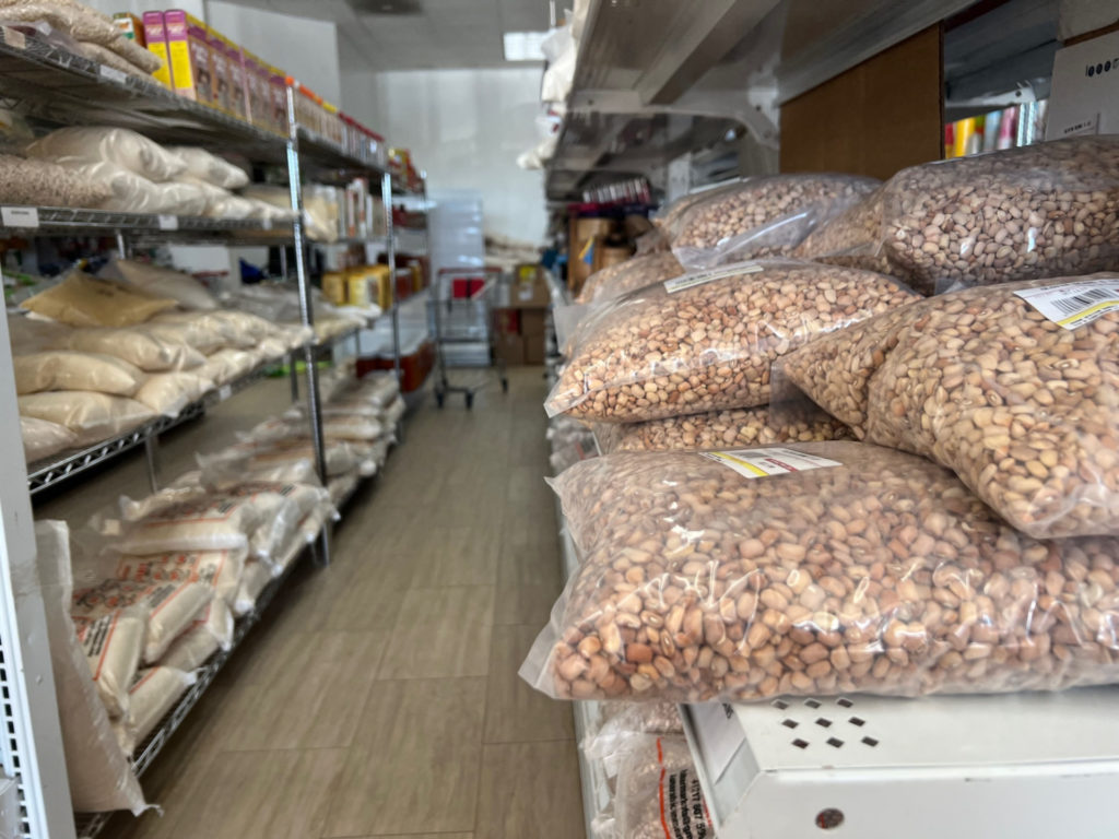 Shelves of grains in plastic bags at Ashar Market in Urbana.