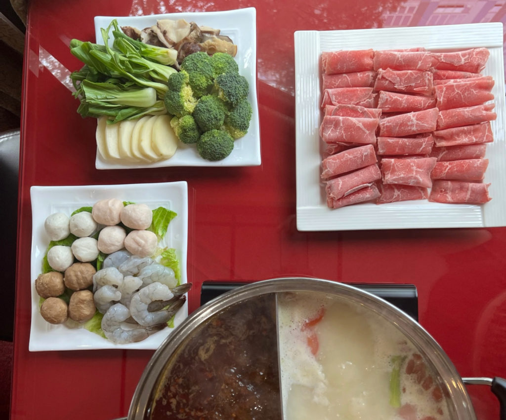The unlimited hot pot at Chong Qing House includes as much vegetables and meats as you can eat.