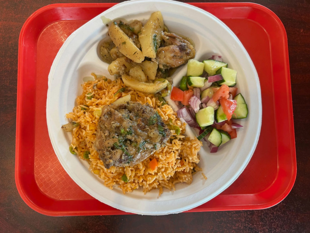 Tajine chicken with rice and veggies from North African Cuisine at Strawberry Fields in Urbana for October things to eat in Champaign-Urbana.