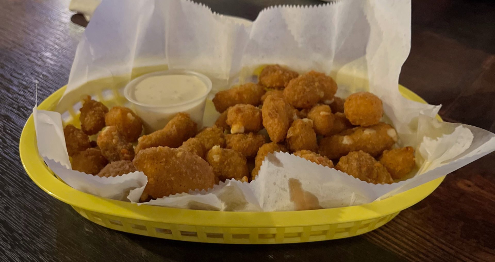Philo Tavern cheese curds in a yellow basket.