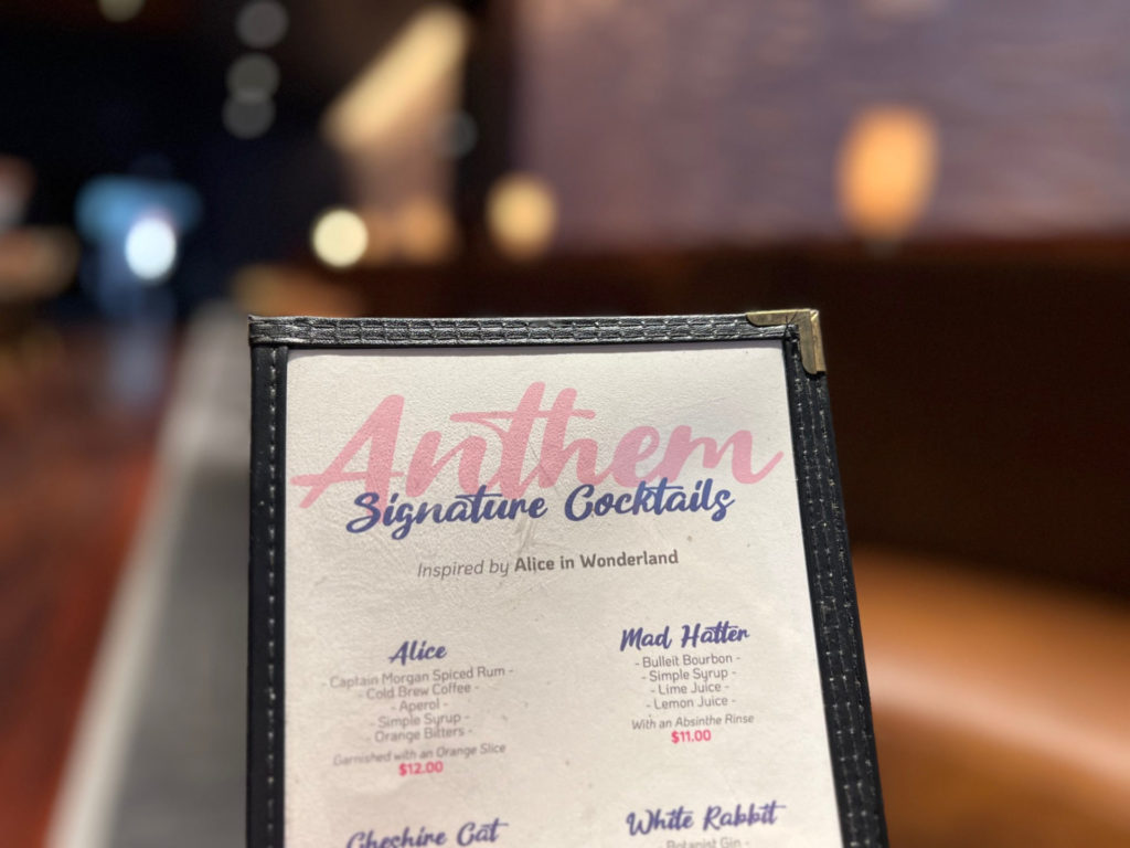 A menu for Anthem with a blurred background.