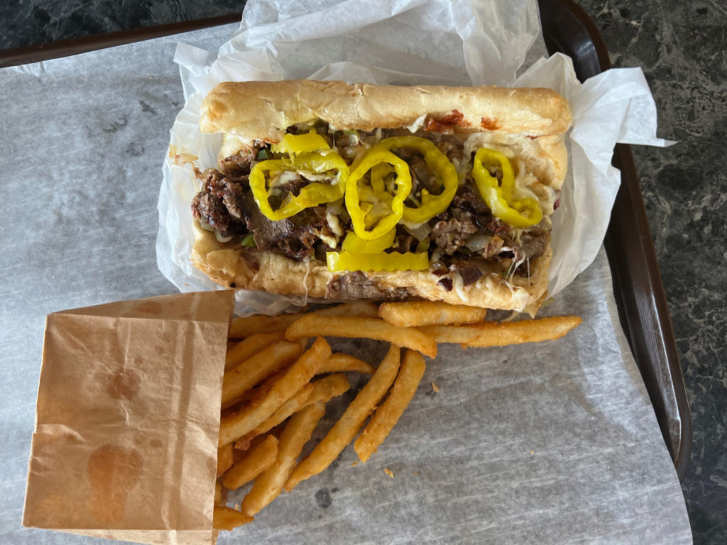 Philly cheesesteak sandwich with fries from Niro's Gyros in Champaign.