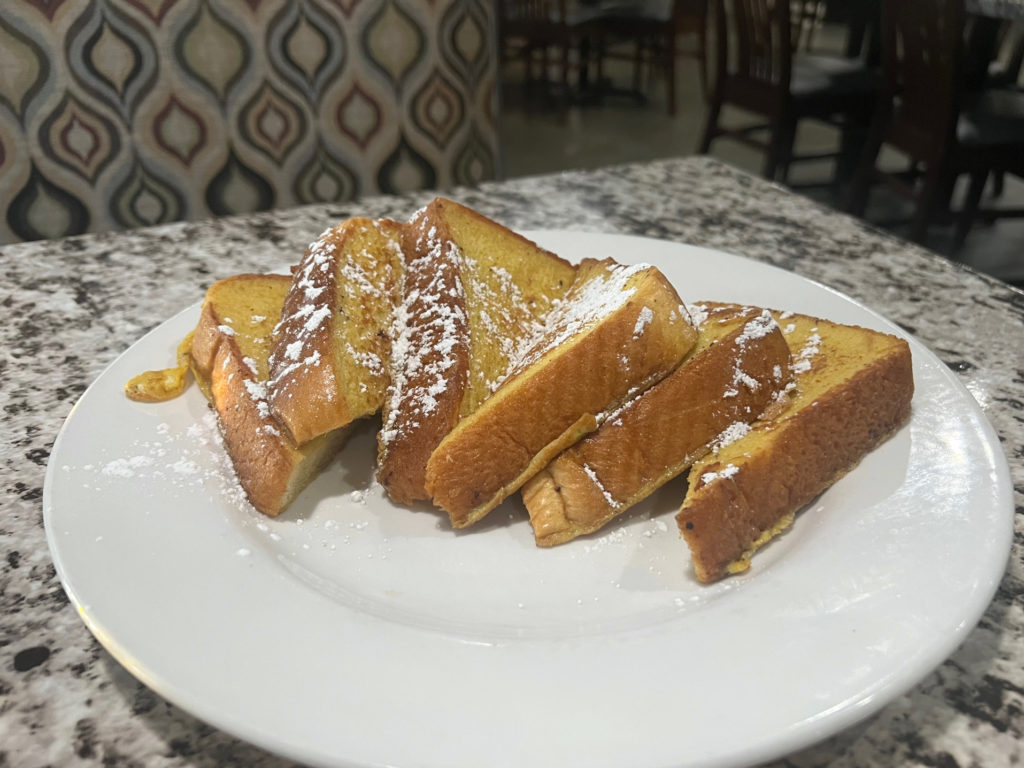 Six half-slices of traditional French toast at Sweet Basil Cafe.