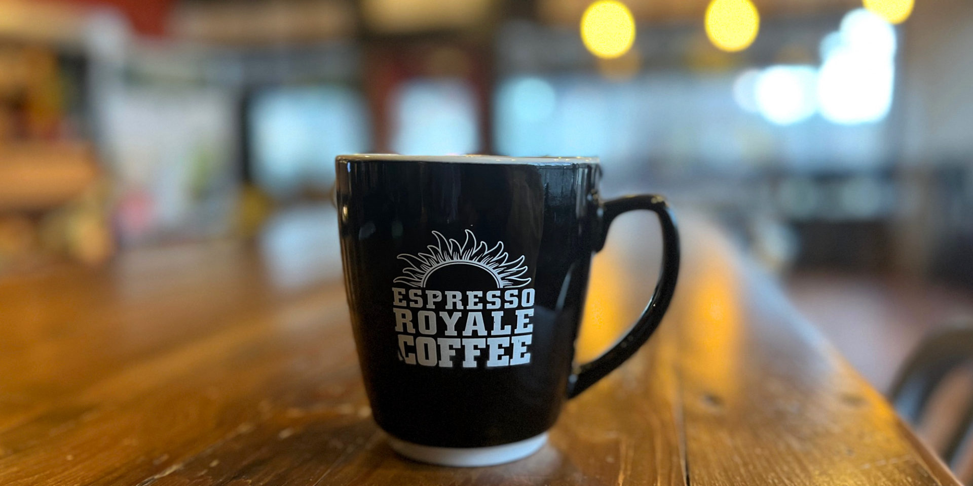 A black mug at Espresso Royale at Krannert View in Champaign, Illinois.