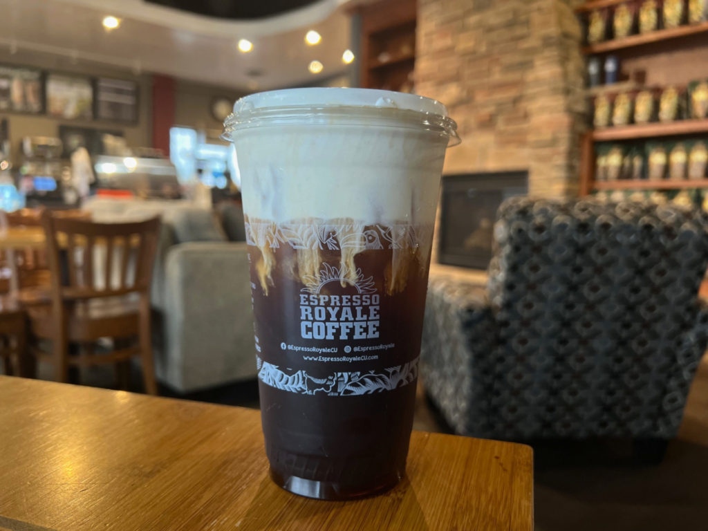 An iced bourbon-barrel Americano with cold foam at the Stadium Plaza location.
