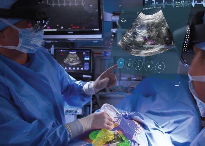 A surgeon in blue scrubs performing a procedure. There is a hologram of an ultrasound image hovering above the patient.