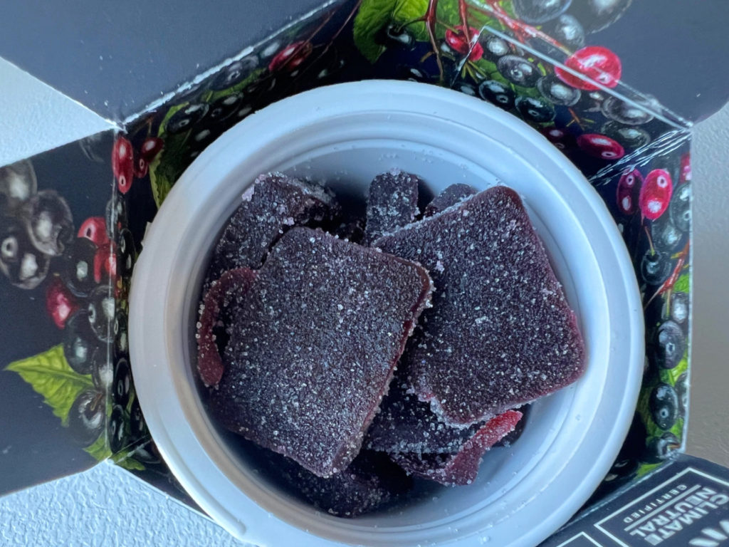A package of Wyld gummies with dark red elderberry candy coated in white sugar.