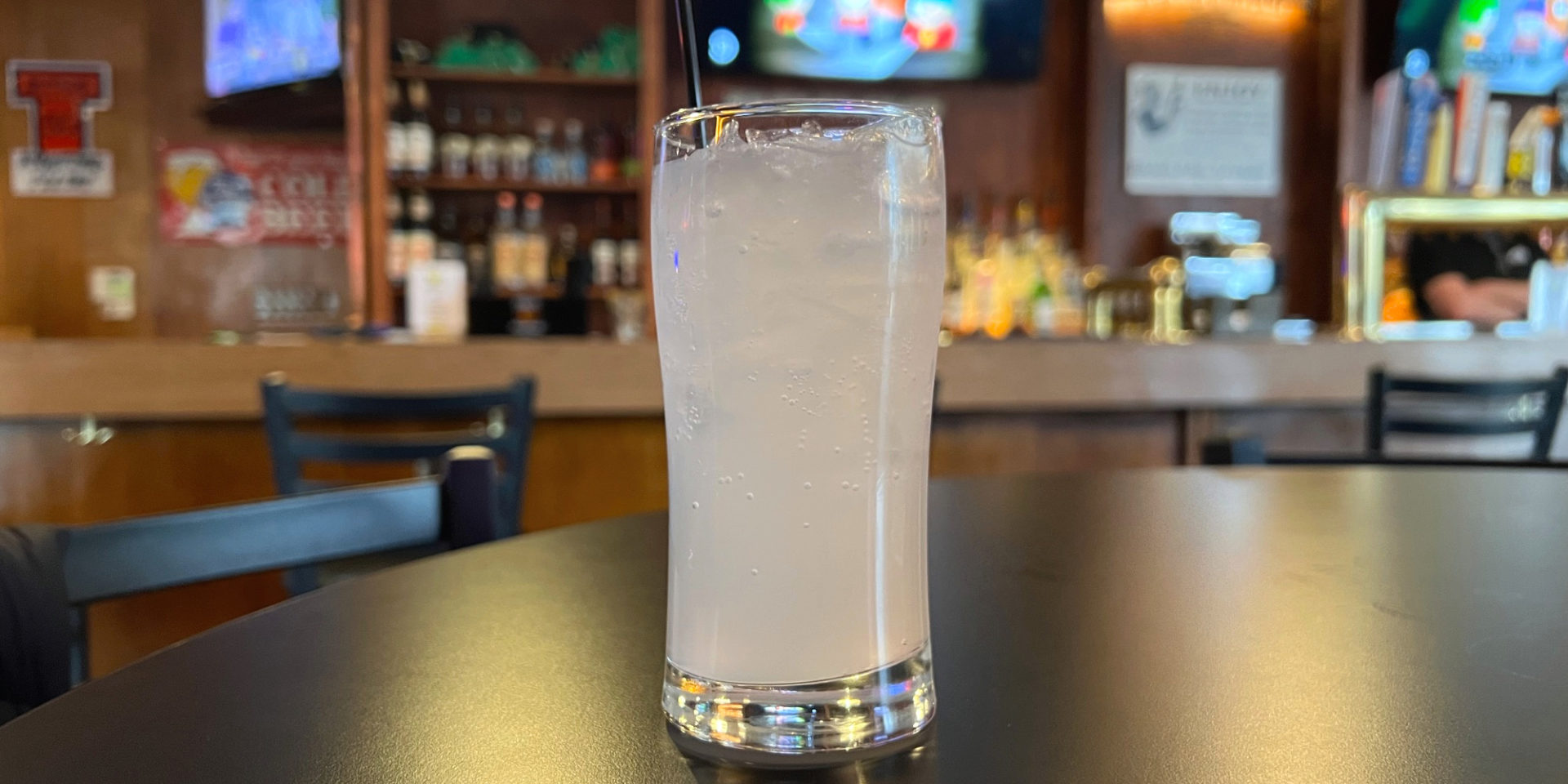 A Squint (Squirt soda and gin) in a glass cup inside Brass Rail in Downtown Champaign.