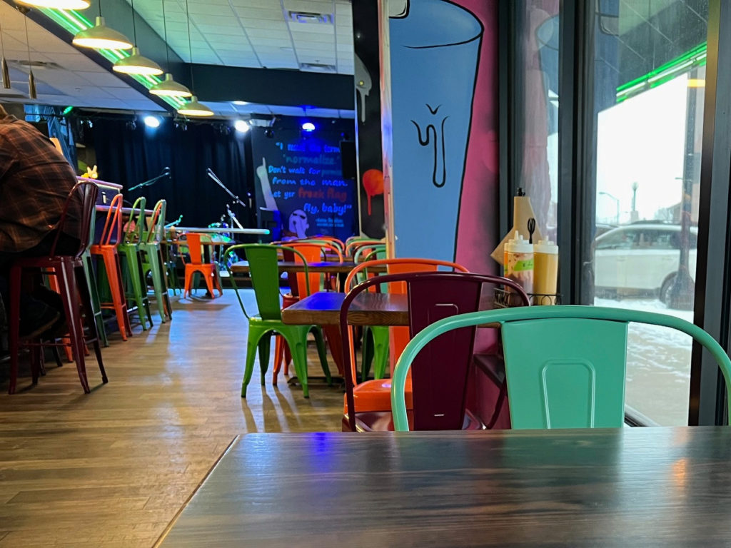 The Space dining room has colorful metal chairs.