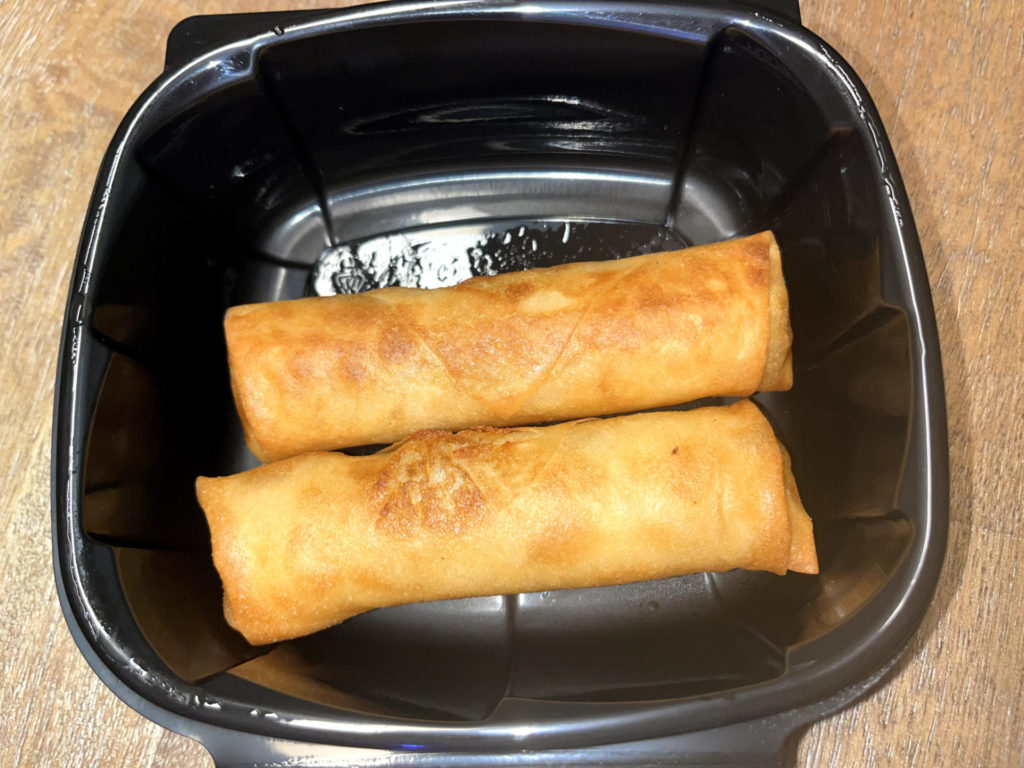 Two spring rolls filled with chicken and potato.