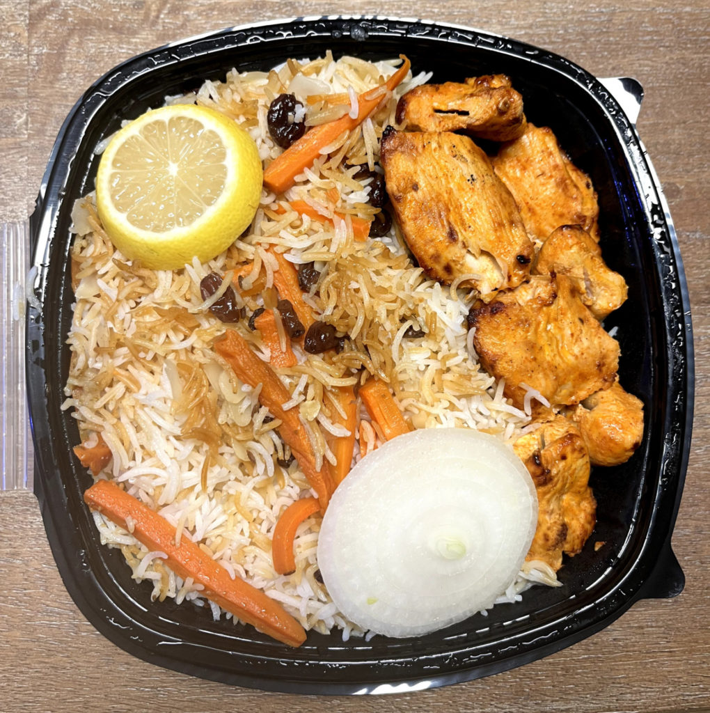 An order of chicken and rice to-go from Afghan Cuisine Restaurant.