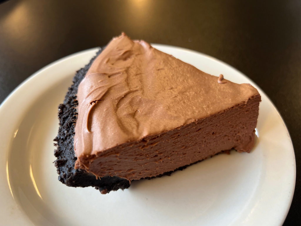 A slice of chocolate cream pie