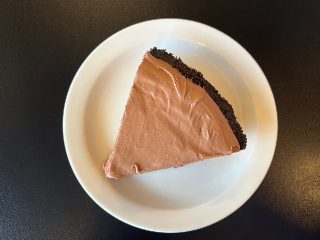 A slice of chocolate cream pie.
