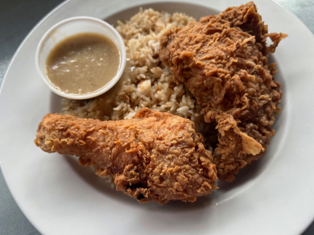 The crispy chicken at A Taste of Both Worlds with rice and gravy.