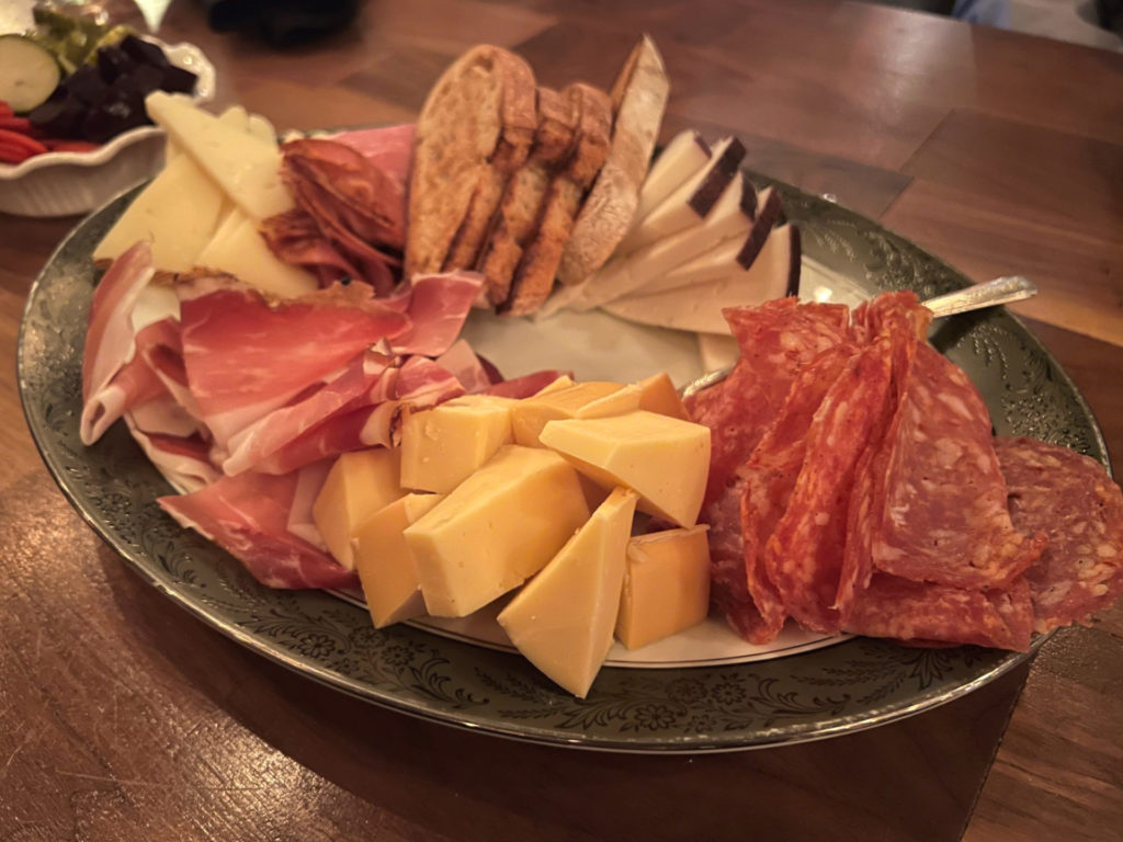 A platter of three meats and three cheeses at Bakery & Pickle restaurant in Bloomington, Illinois.