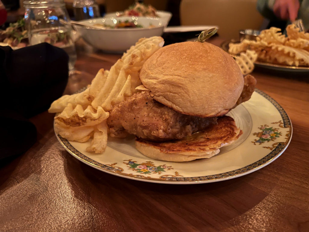 The fried chicken sandwich with waffle fries at Bakery & Pickle retaurant.
