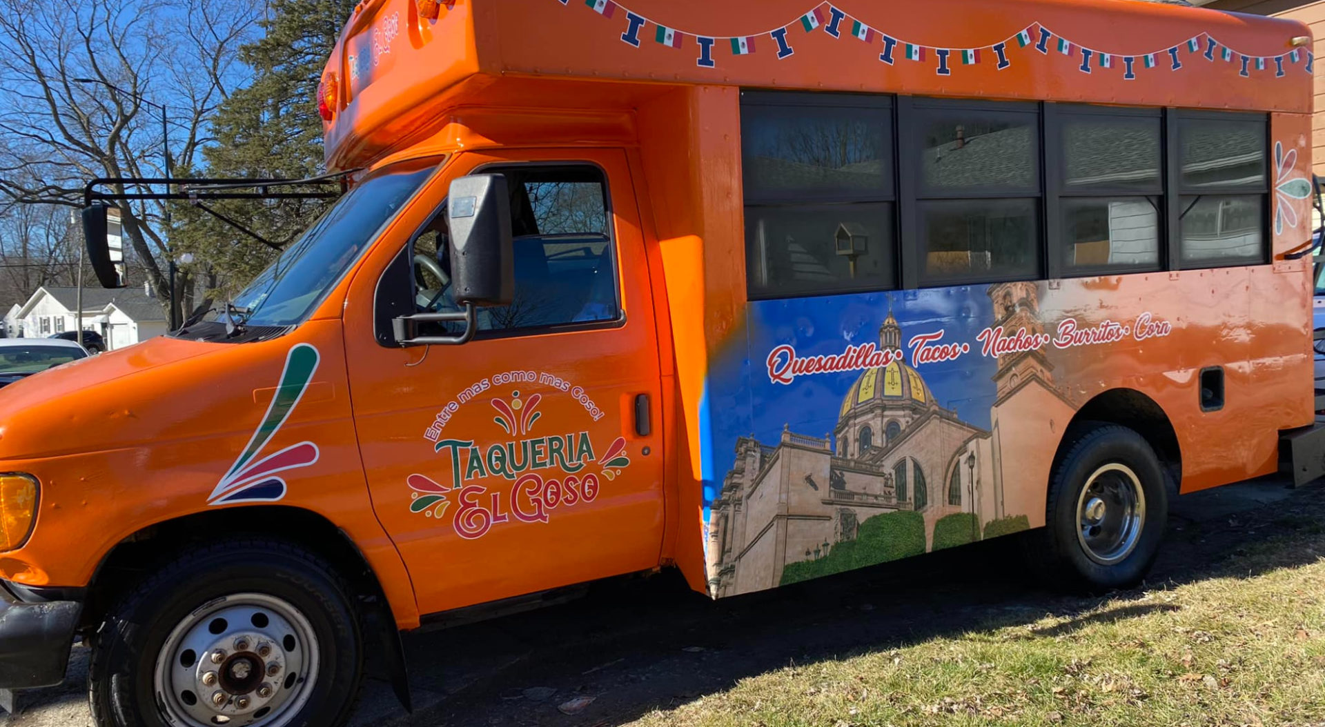 An orange food truck Taqueria El Goso- Entre is new to the Champaign-Urbana food scene.