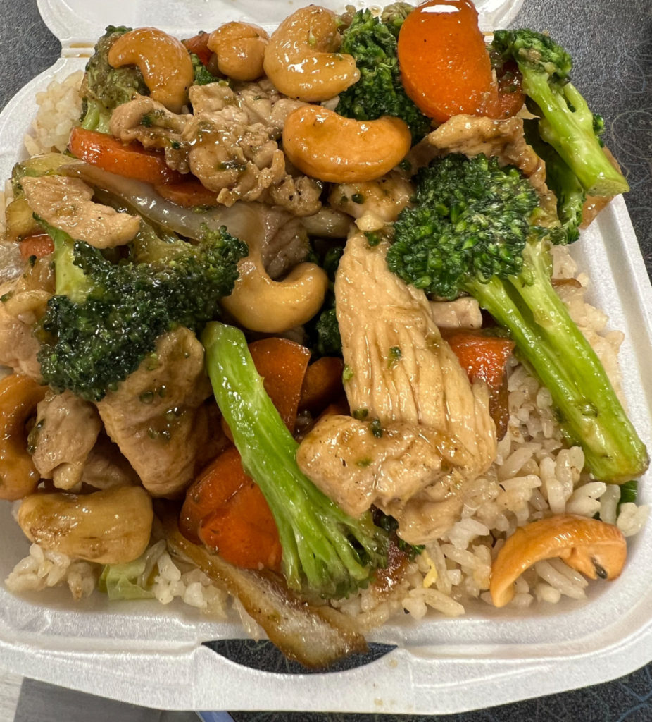 A styrofoam container of cashew chicken with vegetables from Thai Fusion in the Union.