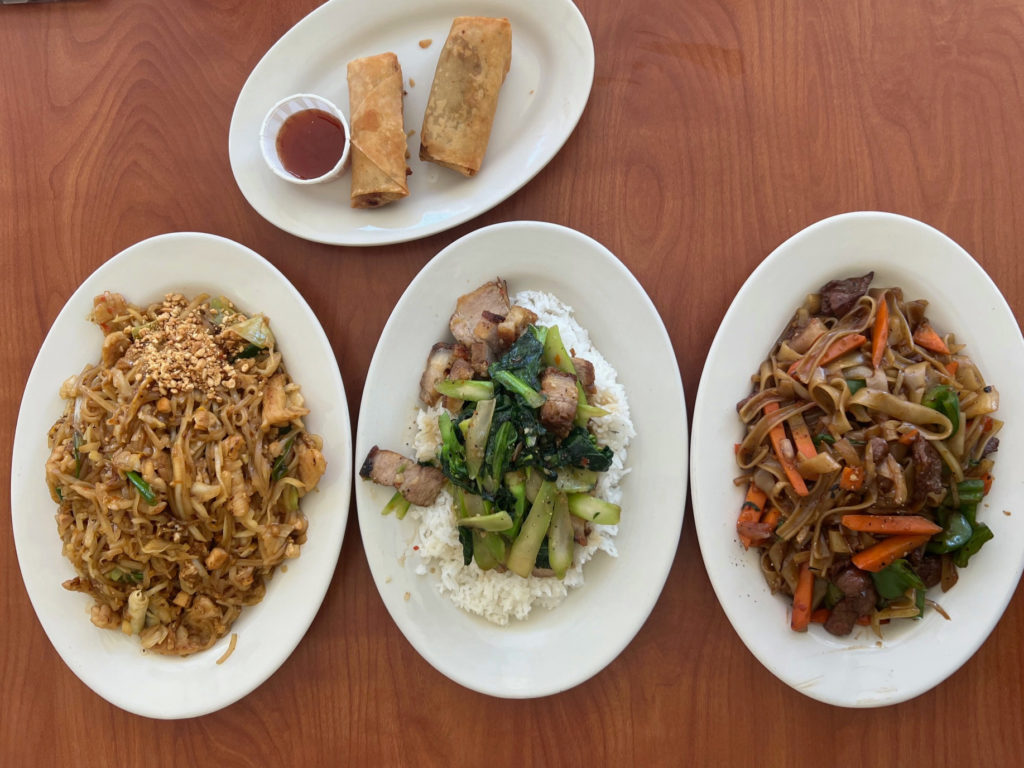 The author's lunch of egg rolls, pad Thai, pad kee mao, and pad ka na at Basil Thai.