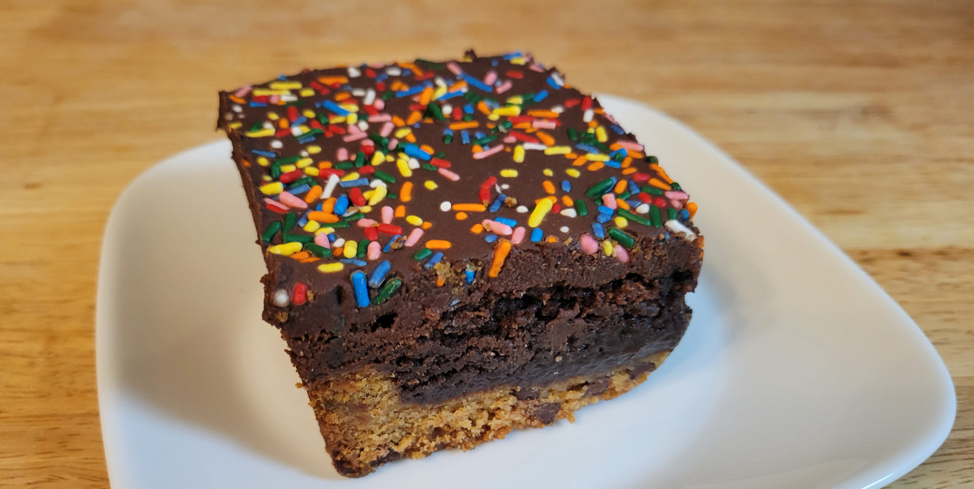 A College Brownie taking up a large portion of a small plate.