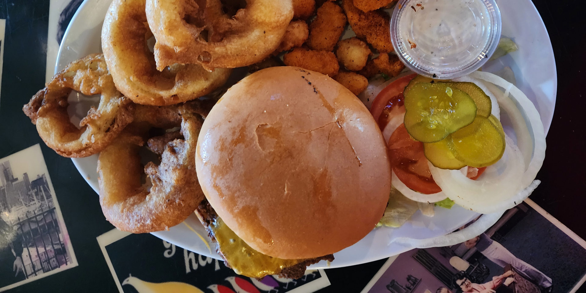 A burger with onion rings at Boomerangs Bar & Grill in Urbana.
