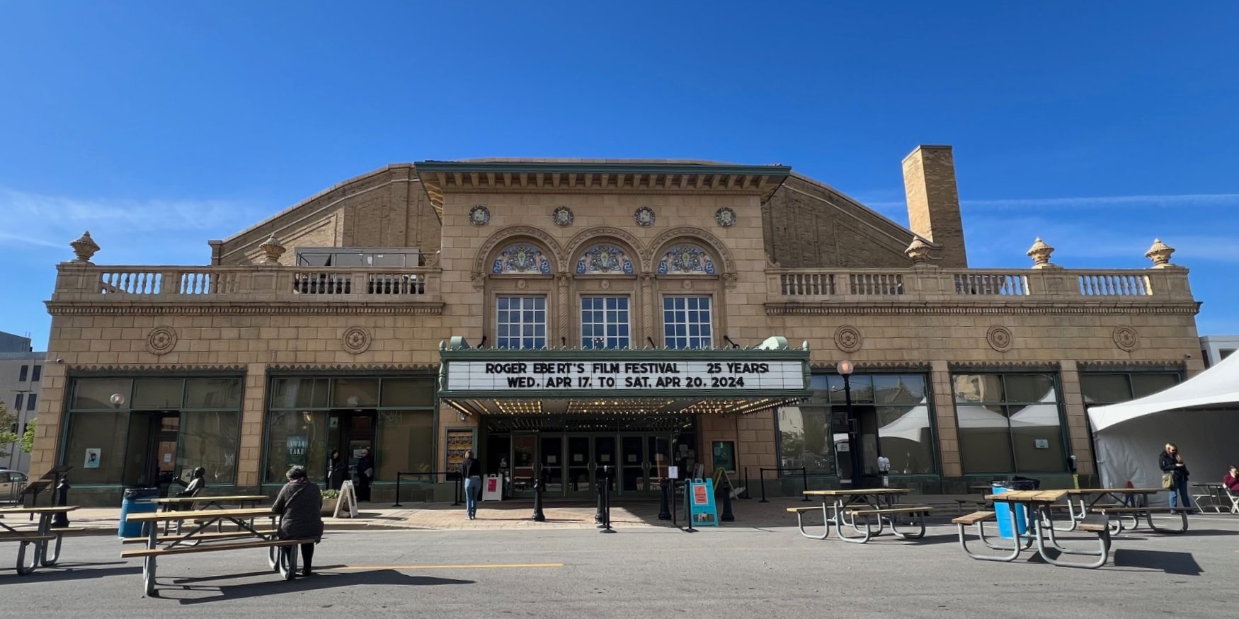 The exterior of The Virginia Theater in Champaign, Illinois with a bright blue sky behind it for Roger Ebert's Film Festival.