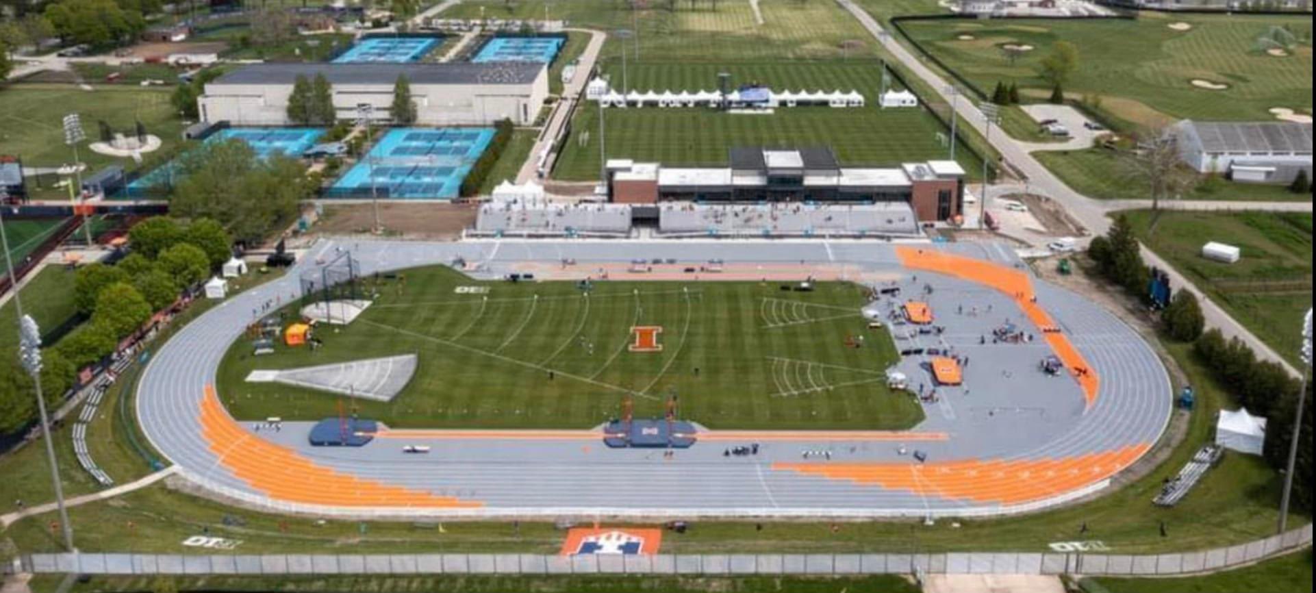 An arial shot of the Gary Wieneke track. It is gray and orange with a a grassy area in the middle.