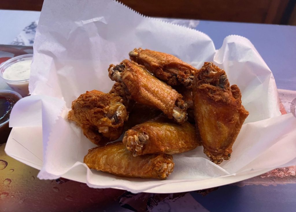 An order of ten wings in a basket at Pia's Sports Bar & Grill