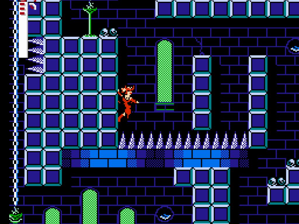 A screenshot of a vintage video game the background is black and there are blue and green rectangles creating a maze and a small character in red trying to get to the other side.